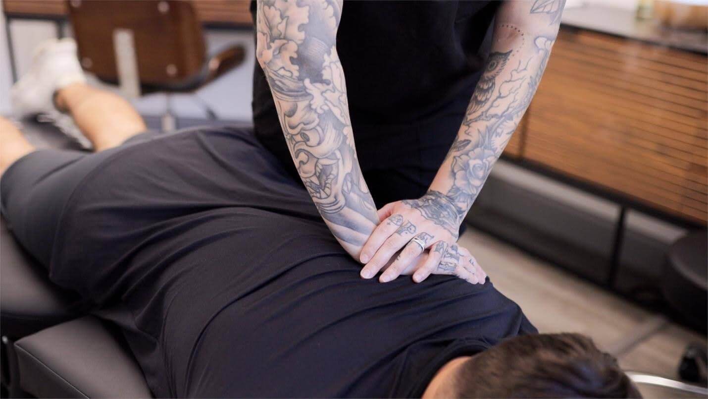 Photo of Dr. Alyssa Garber adjusting a patient. Need access to holistic wellness after business hours? Concierge chiropractic care in Jupiter, FL, ensures you have access to support and wellness when you need it.